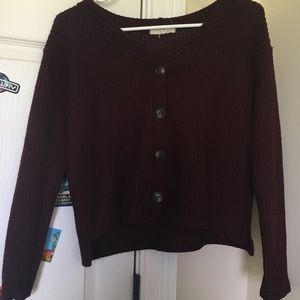 Maroon v neck sweater.